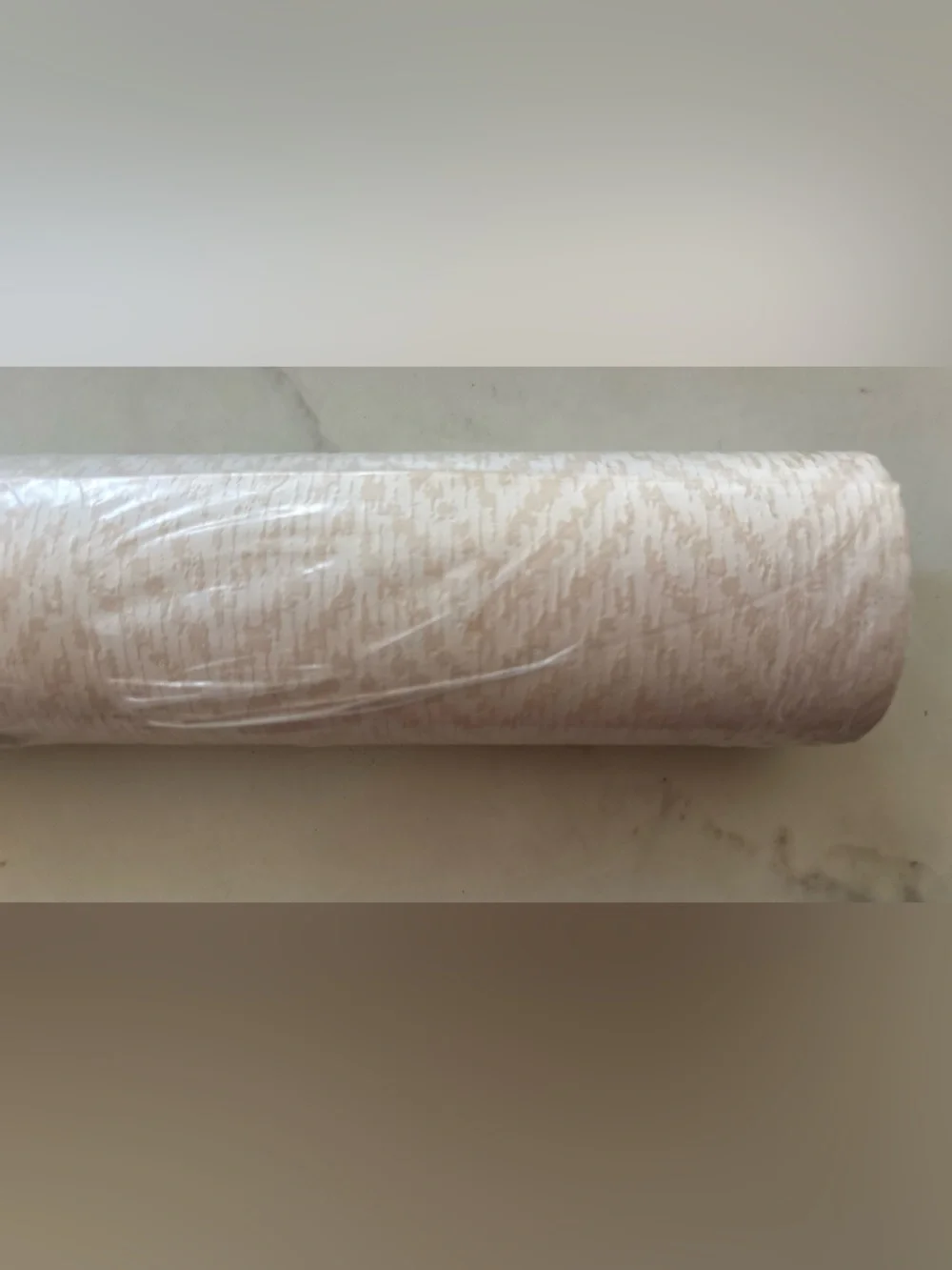 One Roll Wallcoverings wallpaper beige cream abstract design